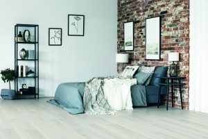 Spacious brick wall bedroom | Roberts Carpet & Fine Floors