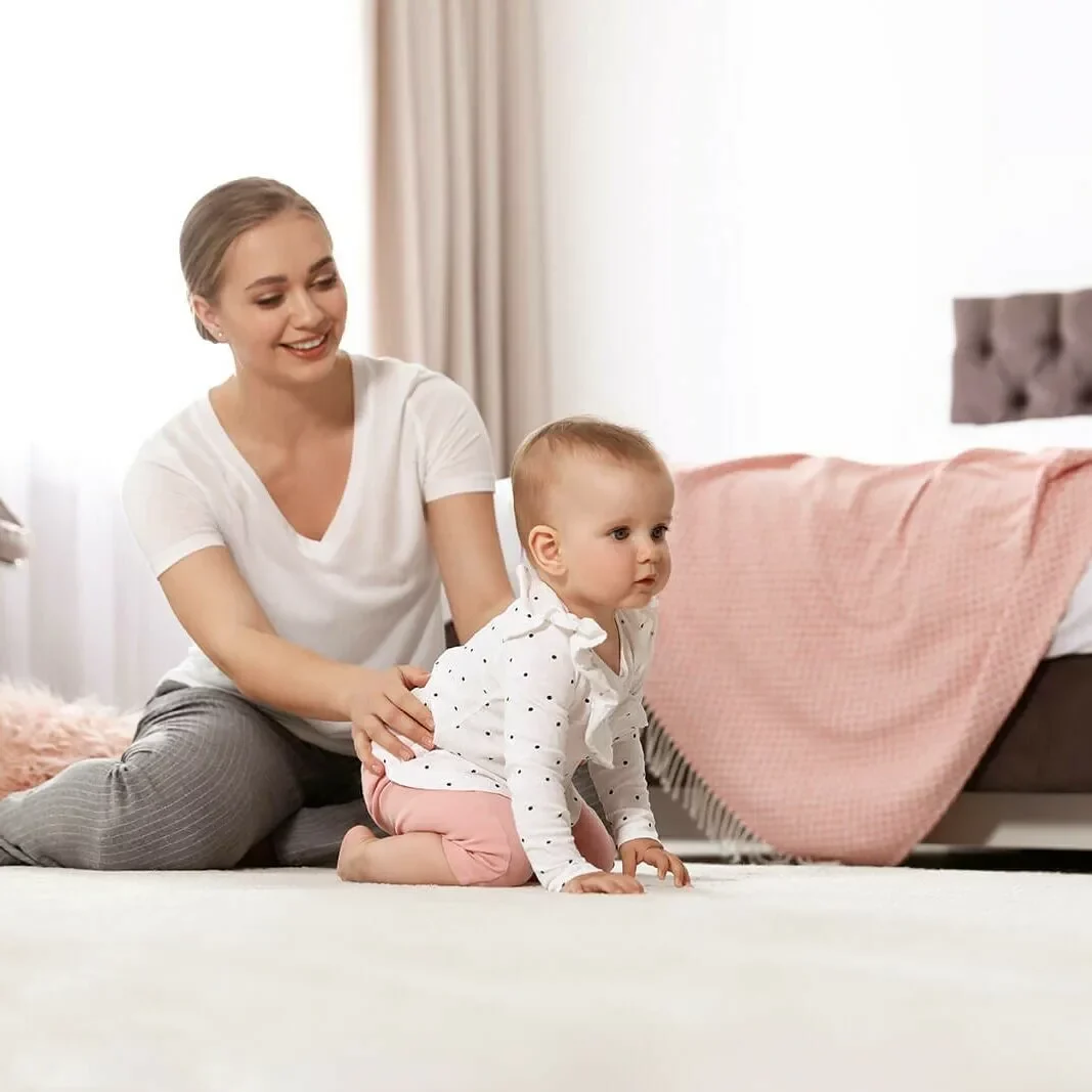 Baby and Mom Playing on Carpet | Roberts Carpet & Fine Floors