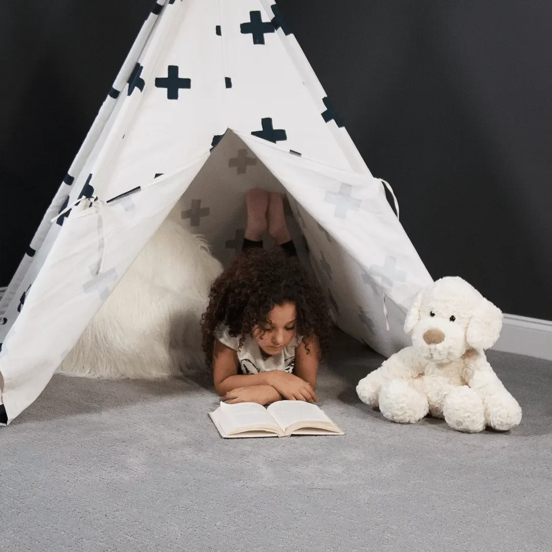 C10309-Girl-reading-book-on-carpet_LiveWell-Dixie-Cozy-Mood-