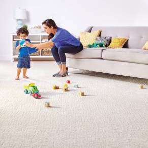 Kid spilling water and model trying to stop it | Roberts Carpet & Fine Floors